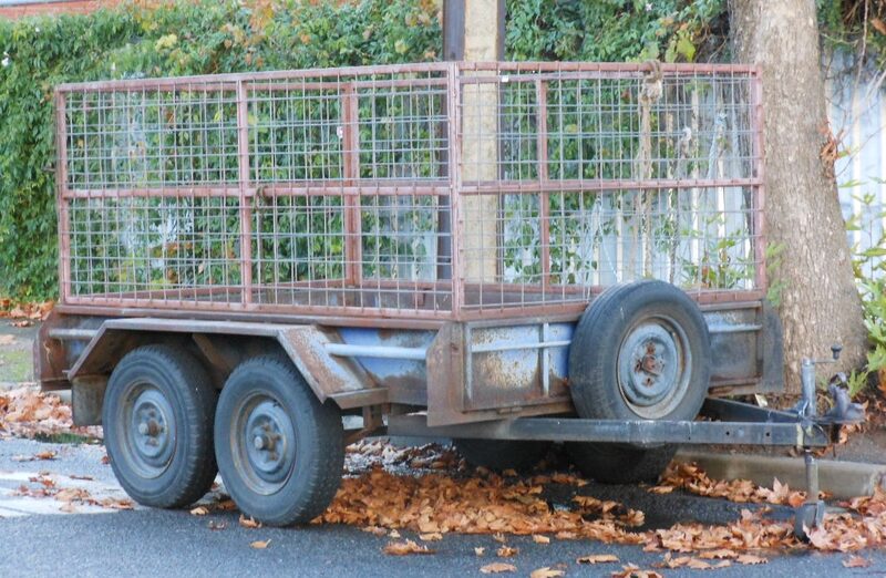 Caged hire trailer parked on a suburban street